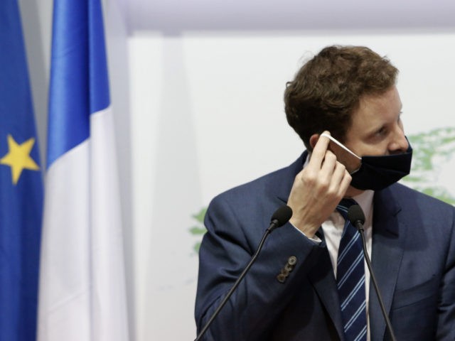 France's Minister for European Affairs Clement Beaune, adjusts his face mask after a