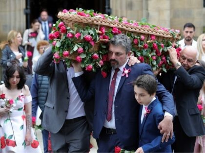 MANCHESTER, ENGLAND - JULY 26: Andrew Roussos, the father of Saffie Roussos (C) holds his son Xander Roussos whilst carrying the coffin of his daughter following the funeral of the young Manchester Attack victim at Manchester Cathedral on July 26, 2017 in Manchester, England. Saffie Rousso, aged eight, from Lancashire …