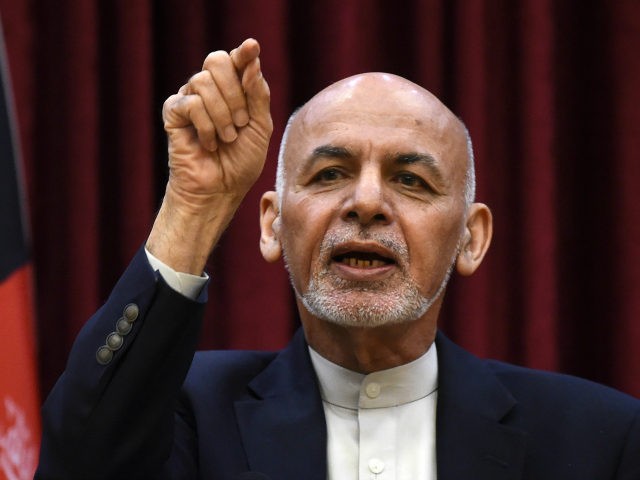 Afghan President Ashraf Ghani gestures as he speaks during a press conference at the presi