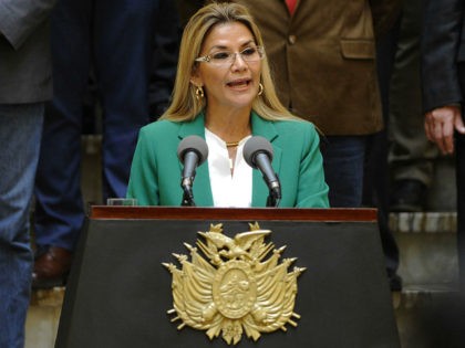 Bolivian interim President Jeanine Anez gives a speech during the celebration of Plurinational State day at Palacio Quemado, in La Paz, on January 22, 2020. Bolivian interim President instructed on Wednesday her ministers of Defense and Government to prepare a plan to protect the elections of May 3, after the …