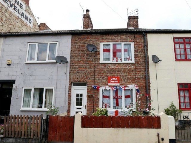 English Cross of St George flags hang in the windows and a "Vote Leave" poster is displayed on a house in Redcar, north east England on June 27, 2016 Britain's historic decision to leave the 28-nation bloc has sent shockwaves through the political and economic fabric of the nation. It …