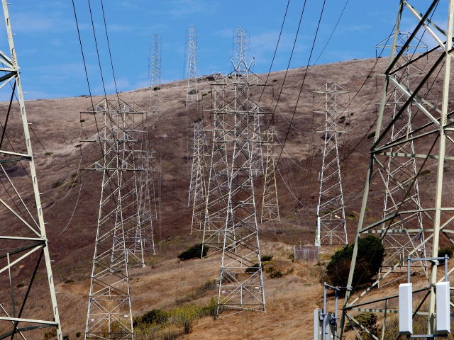 Towers carrying electical lines are shown August 30, 2007 in South San Francisco, California. With temperatures over 100 degrees in many parts of the state, the California Independent System Operator, which manages most of the California electricity grid, is planning on declaring a minor power emergency later in the day, …