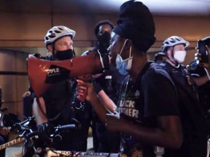 BLM yells at police through megaphone