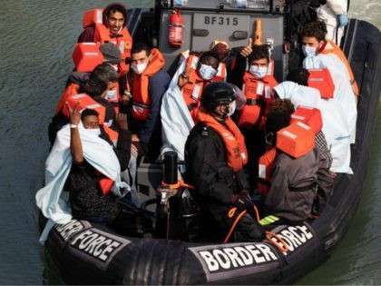 DOVER, ENGLAND - SEPTEMBER 22: Border Force officials unload migrants, that have been inte