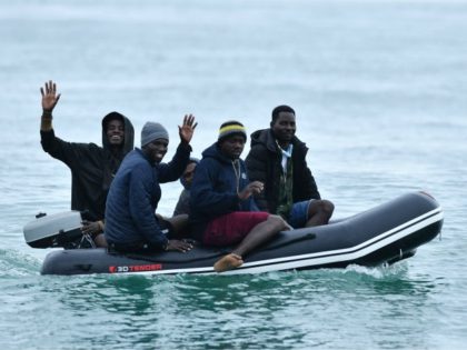 Migrants in a dinghy sail in the Channel toward the south coast of England on September 1,