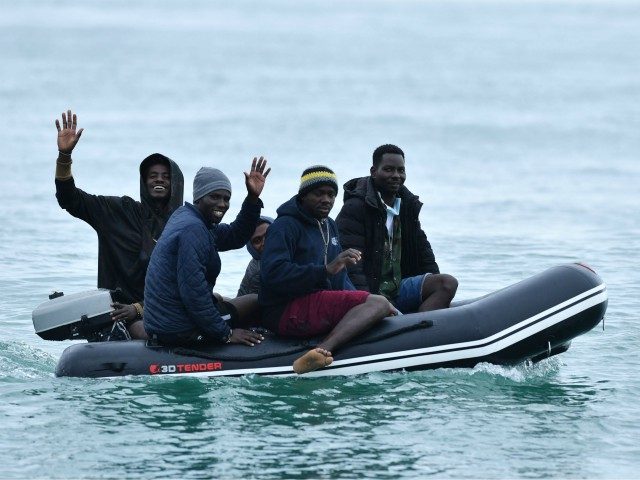 Migrants in a dinghy sail in the Channel toward the south coast of England on September 1, 2020 after crossing from France. - Migrant crossings of the Channel between France and England have hit record numbers, with thousands having arrived in small boats since the beginning of the year. The …