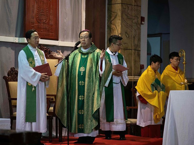 Bishop Joseph Li Shan leads a mass at the South Cathedral in Beijing on September 22, 2018. - The Vatican on September 22 announced a historic accord with China on the appointment of bishops in the Communist country as Pope Francis recognised seven Beijing-appointed bishops in a move that could …