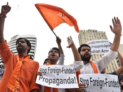 Indian activists from the Akhila Bharata Vidyarthy Parishat (ABVP) organisation shout slogans during a protest outside the Amnesty International in New Delhi on August 17, 2016. Students from the ABVP are demanding police take action against the organisers of an event held on disputed Indian Kashmir, which led to sedition …