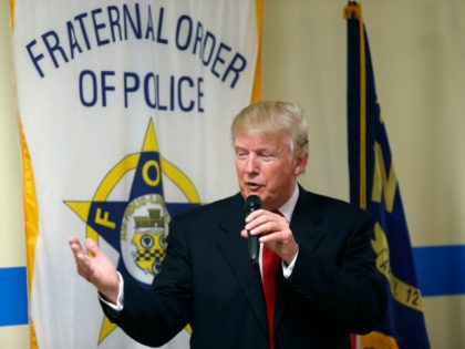 In this Aug. 18, 2016, file photo, Republican presidential candidate Donald Trump speaks to retired and active law enforcement personnel at a Fraternal Order of Police lodge during a campaign stop in Statesville, N.C. The endorsement by a national police organization for Trump has exposed a divide within the ranks …