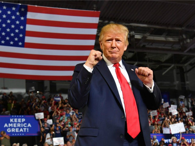 US President Donald Trump pumps his fists as he arrives for a "Make America Great Again" rally at Minges Coliseum in Greenville, North Carolina, on July 17, 2019. (Photo by Nicholas Kamm / AFP) (Photo by NICHOLAS KAMM/AFP via Getty Images)