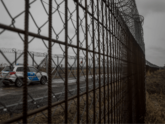 BUDAPEST, HUNGARY - JANUARY 18: Police patrol the Hungarian border fence with Serbia on January 18, 2019 outside Szeged, Hungary. In 2015 thousands of migrants massed on the Hungarian border. The situation pushed Prime Minister Vicktor Orban’s government to build a fence along it’s borders with Serbia, the resulting thirteen-foot-tall …