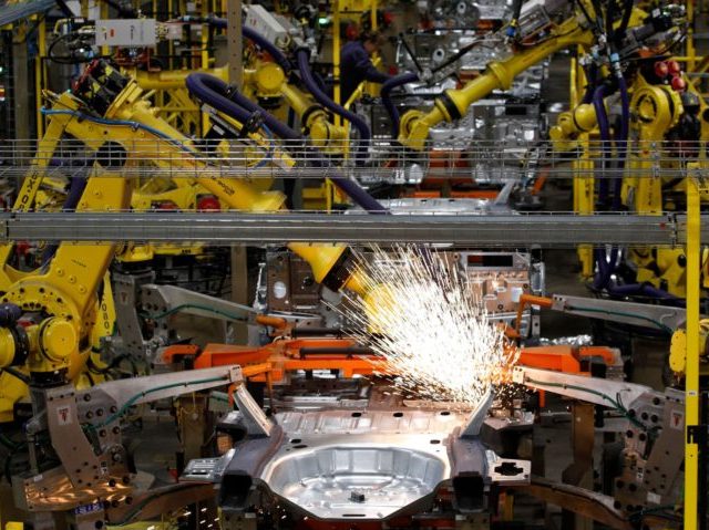 Workers assemble cars at the newly renovated Ford's Assembly Plant in Chicago, June 24, 2019. - The plant was revamped to build the Ford Explorer, Police Interceptor Utility and Lincoln Aviator. (Photo by JIM YOUNG / AFP) (Photo credit should read JIM YOUNG/AFP via Getty Images)