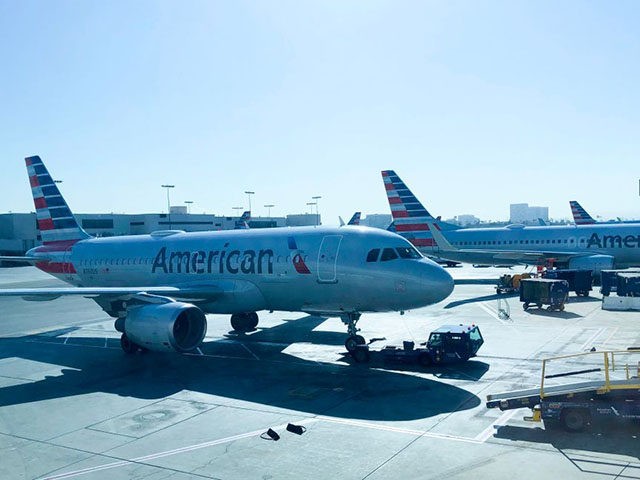 An American Air Lines plane sits on the tarmac at Los Angeles International Airport (LAX)