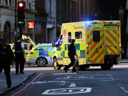LONDON, ENGLAND - NOVEMBER 29: An ambulance is let through a police cordon near Borough Market after a number of people are believed to have been injured after a stabbing at London Bridge, police have said, on November 29, 2019 in London, England. Police said they were called to the …