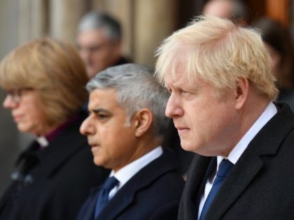 London mayor Sadiq Khan (C) and Britain's Prime Minister Boris Johnson take part in a vigil at the Guildhall in central London to pay tribute to the victims of the London Bridge terror attack on December 2, 2019. (Photo by DANIEL LEAL-OLIVAS / AFP) (Photo by DANIEL LEAL-OLIVAS/AFP via Getty …
