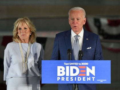 Democratic presidential hopeful former Vice President Joe Biden speaks, flanked by his wif