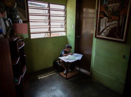 CARACAS, VENEZUELA - APRIL 28: Fourth grade Carlos Alayon does the schoolwork at home during the second month of quarantine in the Country on April 28, 2020 in Caracas, Venezuela. Due to the government-ordered coronavirus lockdown, students in Venezuela will have to attend classes remotely until the end of the …