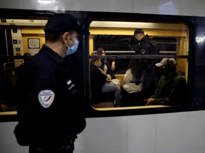 French police officers patrol and control Regional Express Network's (Reseau Express