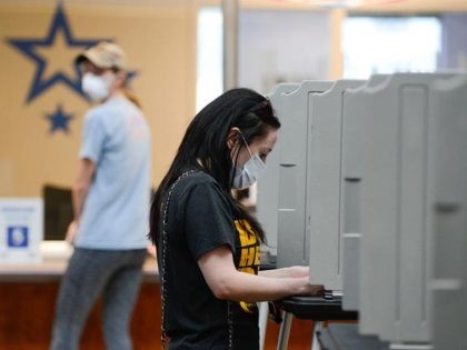 DENVER, CO - JUNE 30: Jennifer Gance votes in the primary election at the Denver Elections