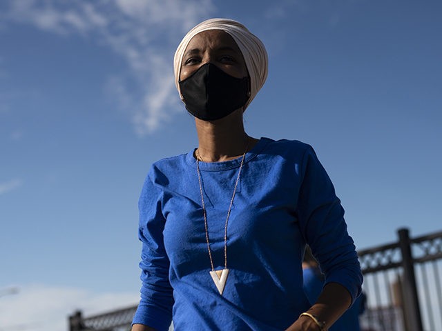 MINNEAPOLIS, MN - AUGUST 11: Rep. Ilhan Omar (D-MN) campaigns at the intersection of Broad
