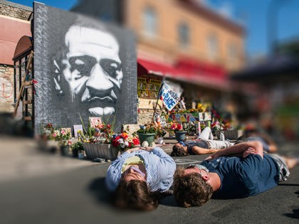 MINNEAPOLIS, MN - AUGUST 17: People participate in a die-in during a demonstration on Augu