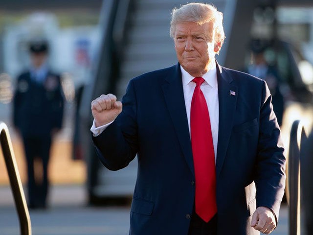 US President Donald Trump arrives to address supporters during a campaign rally at Manches