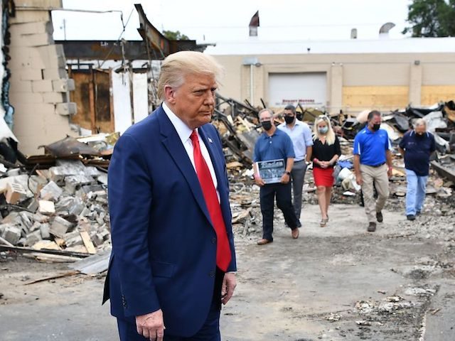 US President Donald Trump tours an area affected by riots in Kenosha, Wisconsin on Septemb