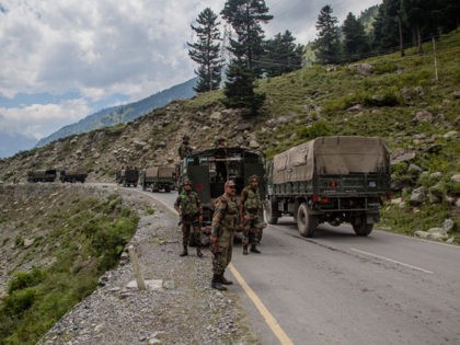 GAGANGIR, KASHMIR, INDIA - SEPTEMBER 2: Indian army convoy carrying reinforcements and supplies, drive towards Leh, on a highway bordering China, on September 2, 2020 in Gagangir, India. India and China, have stumbled once again into a bloody clash over their shared border. India rushed additional troops to Ladakh after …