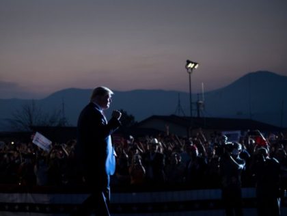 TOPSHOT - US President Donald Trump arrives to speak at a campaign rally at the Minden-Tah