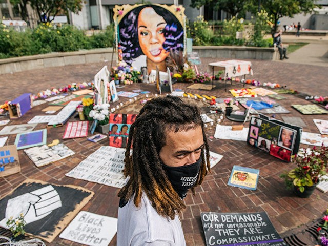 LOUISVILLE, KY - SEPTEMBER 15: A man looks over a memorial dedicated to Breonna Taylor on September 15, 2020 in Louisville, Kentucky. It was announced that the city of Louisville will institute police reforms and pay $12 million to the family of Breonna Taylor, who was fatally shot by Louisville …