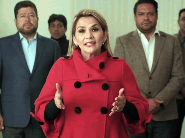 This picture released by hte Bolivian goverment shows the interim president of Bolivia, Jeanine Anez, announcing her withdrawal from the presidential race a month before the elections in La Paz, Bolivia on September 17, 2020. - Anez took office in November 2019, after Morales resigned amid social upheaval. She promised …