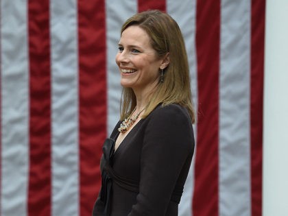 US President Donald Trump announces his US Supreme Court nominee, Judge Amy Coney Barrett (R), in the Rose Garden of the White House in Washington, DC on September 26, 2020. - Barrett, if confirmed by the US Senate, will replace Justice Ruth Bader Ginsburg, who died on September 18. (Photo …