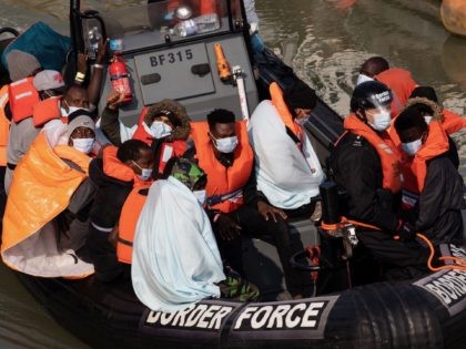 DOVER, ENGLAND - SEPTEMBER 22: Border Force officials unload migrants, that have been inte