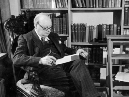 October 1939: Winston Churchill (1874 - 1965) British Statesman and Prime Minister (1940 - 1945, 1951 - 1955) reading a book at his home in Chartwell, Kent. (Photo by Topical Press Agency/Getty Images)