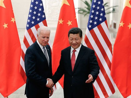 BEIJING, CHINA - DECEMBER 04: Chinese President Xi Jinping (R) shake hands with U.S Vice President Joe Biden (L) inside the Great Hall of the People on December 4, 2013 in Beijing, China. U.S Vice President Joe Biden will pay an official visit to China from December 4 to 5. …