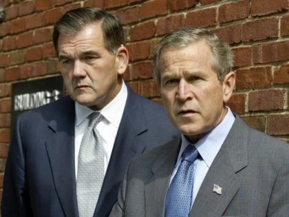 WASHINGTON, : US President George W. Bush(R) answers a reporter's question at the Nebraska Avenue Homeland Security Complex in Washington, D.C. 19 September 2002 as US Director of Homeland Security Tom Ridge(L) stands by. Bush is asking the U.S. Congress to support the possible use of military force against Iraq. …