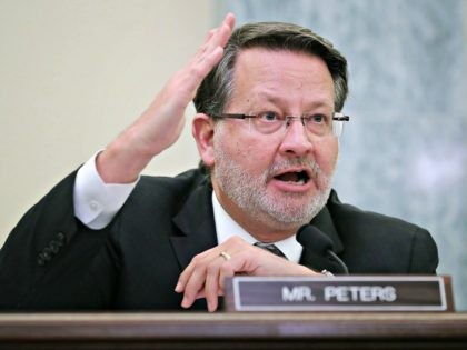 WASHINGTON, DC - JANUARY 23: Senate Surface Transportation and Merchant Marine Infrastructure, Safety, and Security Subcommittee ranking member Sen. Gary Peters (D-MI) questions Transportation Security Administrator David Pekoske during a hearing in the Russell Senate Office Building on Capitol Hill January 23, 2018 in Washington, DC. Pekoske testified about the …