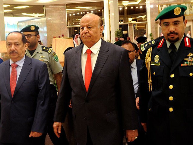 Yemen's exiled President Abed Rabbo Mansour Hadi (C) arrives for the opening of "Riyadh Co