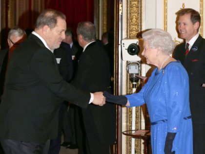 LONDON, UNITED KINGDOM - FEBRUARY 17: Queen Elizabeth II meets Harvey Weinstein during the Dramatic Arts reception at Buckingham Palace on February 17, 2014 in London, England. (Photo by Yui Mok - WPA Pool/Getty Images)