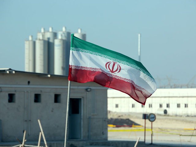 A picture taken on November 10, 2019, shows an Iranian flag in Iran's Bushehr nuclear powe