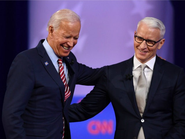 Democratic presidential hopeful former US Vice President Joe Biden (L) laughs with moderator CNN's Anderson Cooper during a town hall devoted to LGBTQ issues hosted by CNN and the Human rights Campaign Foundation at The Novo in Los Angeles on October 10, 2019. (Photo by Robyn Beck / AFP) (Photo …