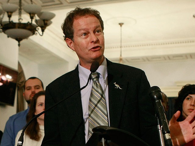 WASHINGTON - DECEMBER 09: John Mackey, CEO of Whole Foods, speaks while surrounded by Whole Foods employees during a news conference on Capitol Hill, December 9, 2008 in Washington, DC. Mackey announced a new legal challenge to the Federal Trade Commission's antitrust review of the proposed merger of Whole Foods …