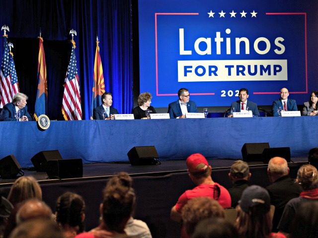 US President Donald Trump (L) and others participate in a roundtable rally with Latino sup