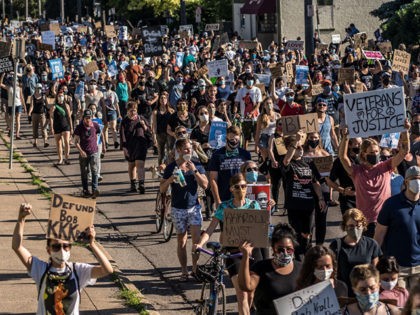 Demonstrators march against racism and police brutality and to defund the Minneapolis Police Department on June 12, 2020 in Minneapolis, Minnesota. (Photo by Kerem Yucel / AFP) (Photo by KEREM YUCEL/AFP via Getty Images)