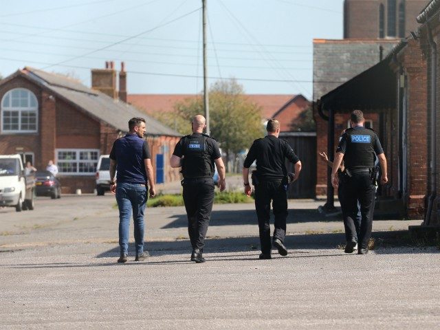 FOLKESTONE, UNITED KINGDOM - SEPTEMBER 21: Police officers appear to inspect the new asylu