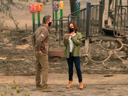 US Democratic vice presidential nominee and Senator from California, Kamala Harris chats with California Governor Gavin Newsom as they visit Pine Ridge Elementary School where they met with firefighters and toured fire-ravaged properties damaged from the Creek Fire nearby in an unincorporated area of Fresno, California on September 15, 2020. …