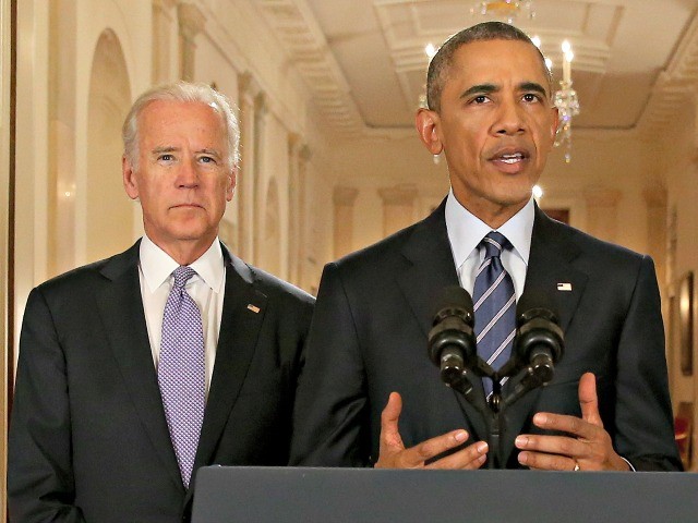President Barack Obama, standing with Vice President Joe Biden, delivers remarks in the East Room of the White House in Washington, Tuesday, July 14, 2015, after an Iran nuclear deal is reached. After 18 days of intense and often fractious negotiation, diplomats Tuesday declared that world powers and Iran had struck a landmark deal to curb Iran's nuclear program in exchange for billions of dollars in relief from international sanctions. (AP Photo/Andrew Harnik, Pool)
