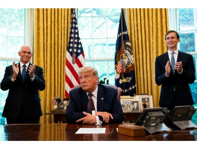 WASHINGTON, DC - SEPTEMBER 11: U.S. President Donald Trump, flanked by U.S. Vice President Mike Pence (L) and Advisor Jared Kushner, speaks in the Oval Office to announce that Bahrain will establish diplomatic relations with Israel, at the White House in Washington, DC on September 11, 2020. The announcement follows …