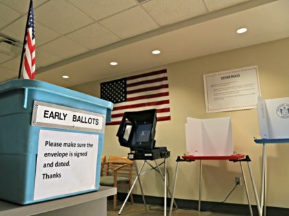 FILE - In this March 21, 2016 file photo, an example of an early ballot collection box and demonstration of voting areas is set up ahead of the state's Presidential Primary Election at the Maricopa County Recorder's office in Phoenix. Lawyers representing state and national Democrat opposed to a new …