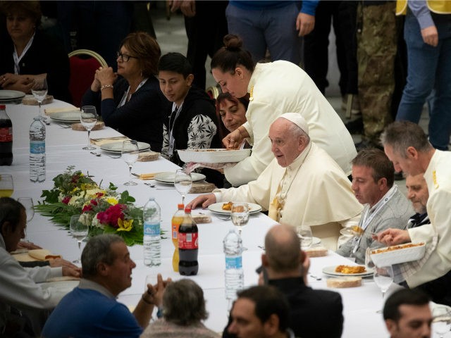Pope Francis sits at a table during a lunch, in the Paul VI Hall at the Vatican, Sunday, Nov. 17, 2019. Pope Francis is offering several hundred poor people, homeless, migrants, unemployed, a lunch on Sunday as he celebrates the World Day of the Poor with a concrete gesture of …
